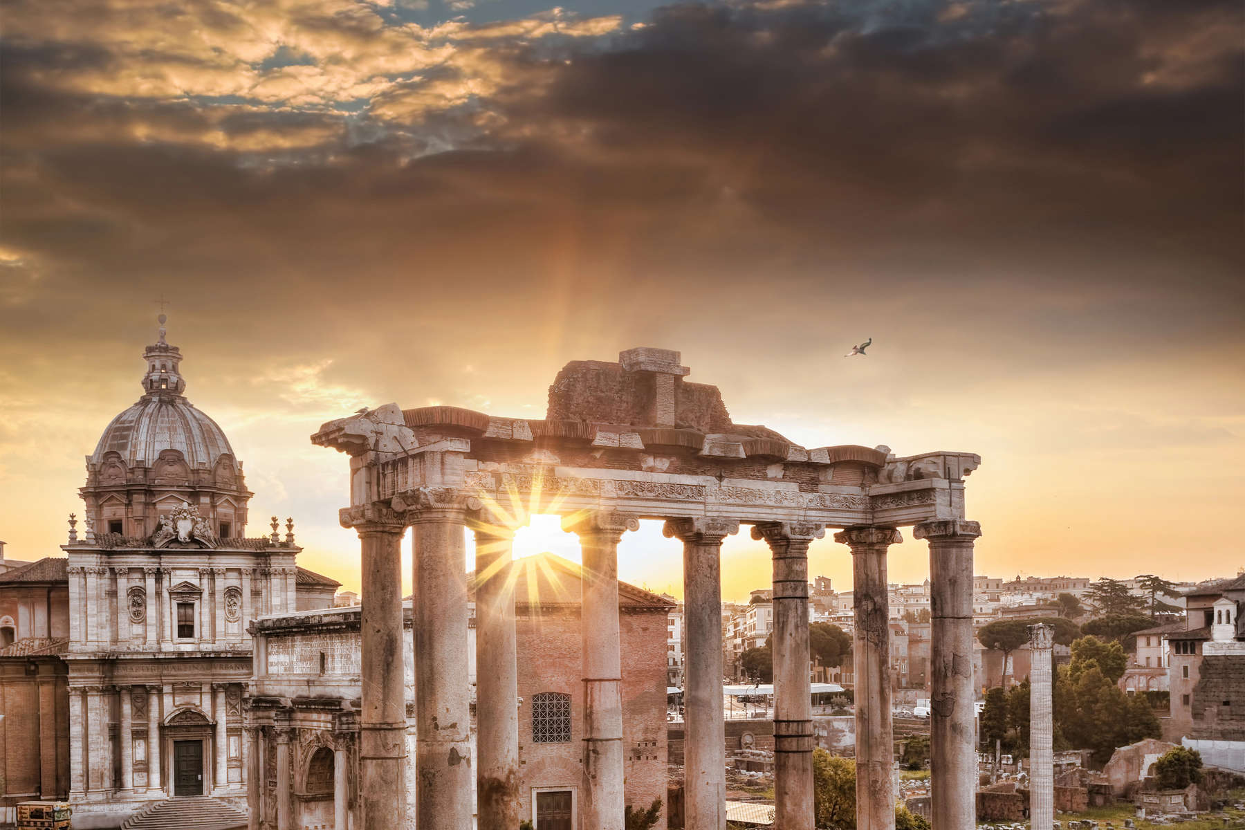 Famous Roman ruins against sunrise in Rome, Italy