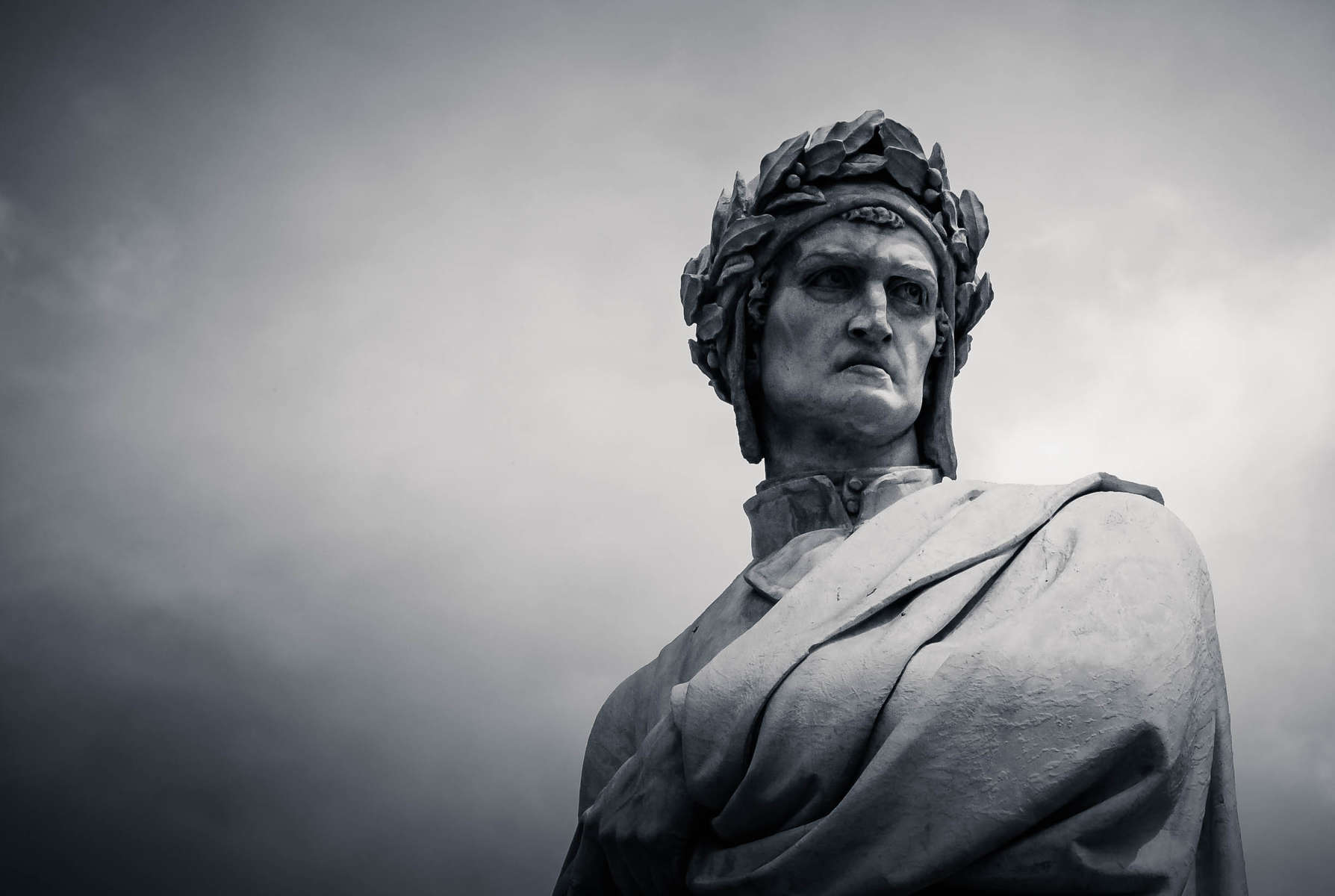 Statue of Dante Alighieri in Piazza Santa Croce, Florence, Italy. Bust shot, copy space, black and white.