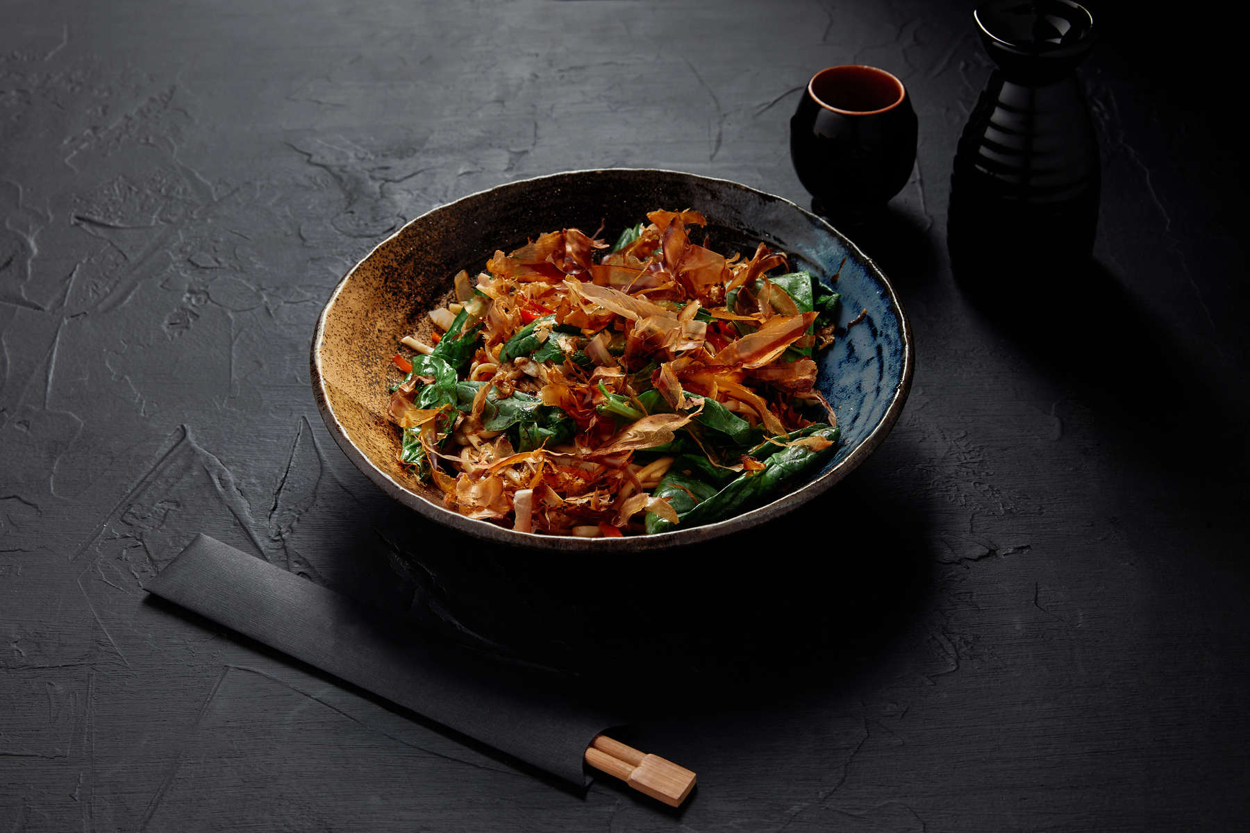 high angle view of delicious japanese dish on plate and chopsticks  