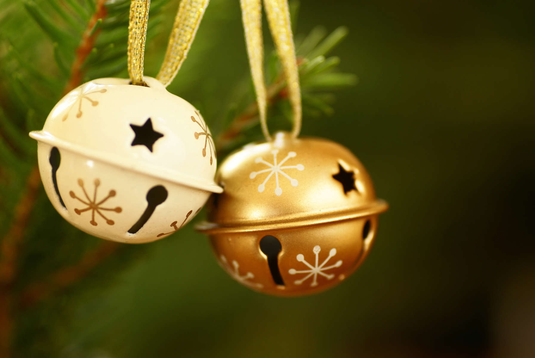 Jingle bells on Christmas tree with copy space.